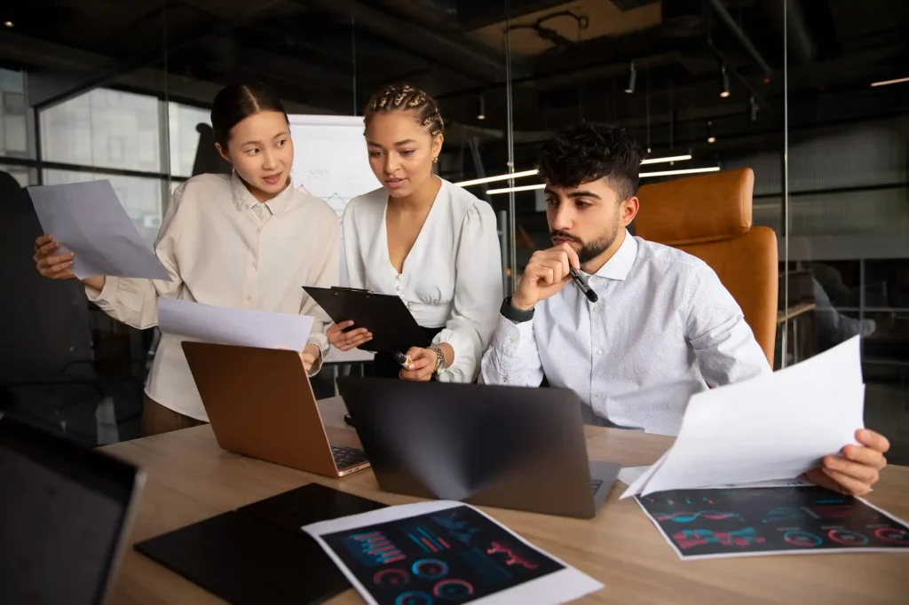 Office workers using planning company's operational workflow